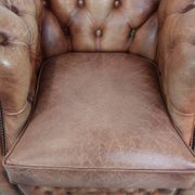 Chesterfield armchair in English style made of cowhide leather