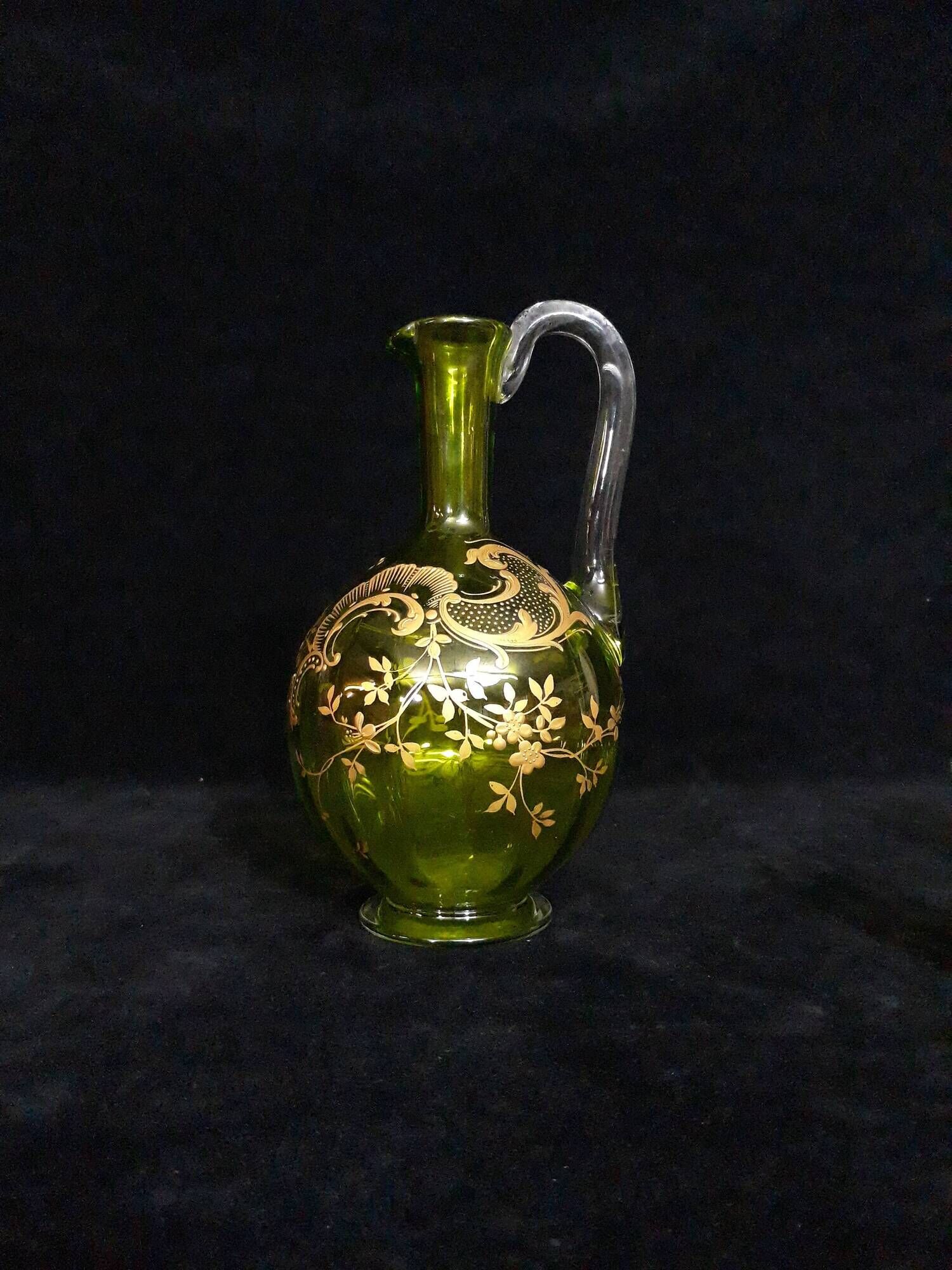 Small carafe and green glass drop glasses with rococo golden emailed decor