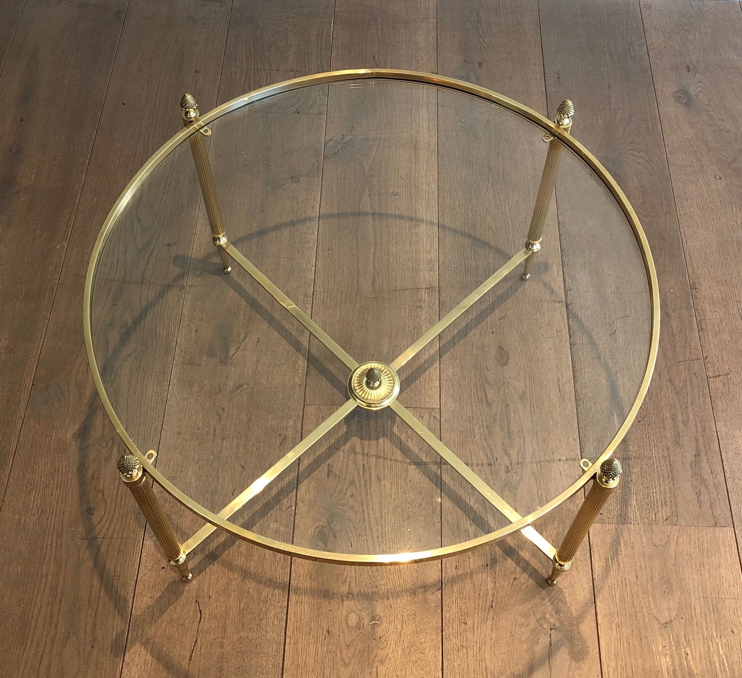 Round brass coffee table. Maison Baguès