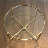 Round brass coffee table. Maison Baguès