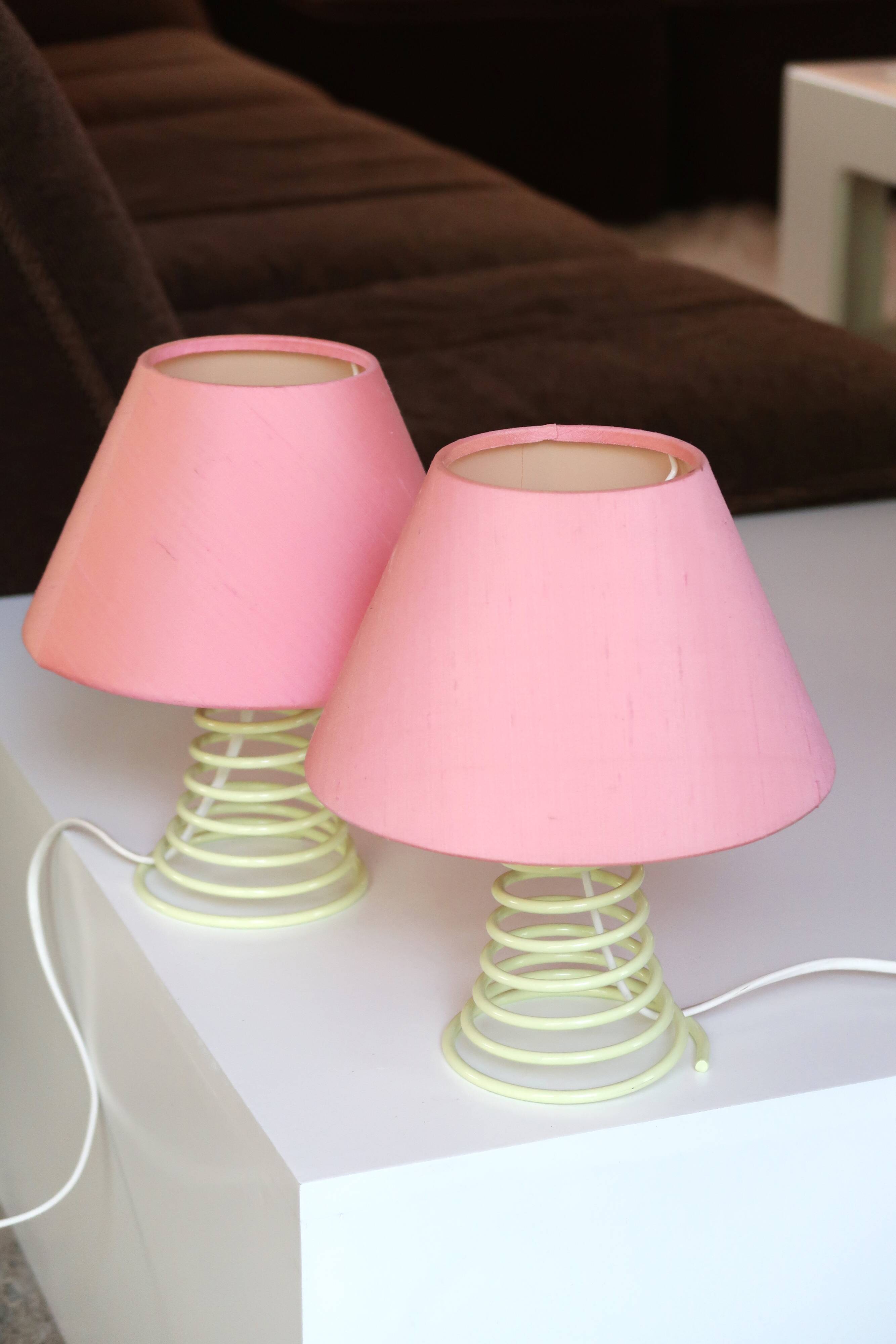 Pair of lamps, yellow spring foot, pink lampshade, 90s