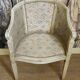 Gondola armchair in Louis XVI style, carved wood with a cream patina.