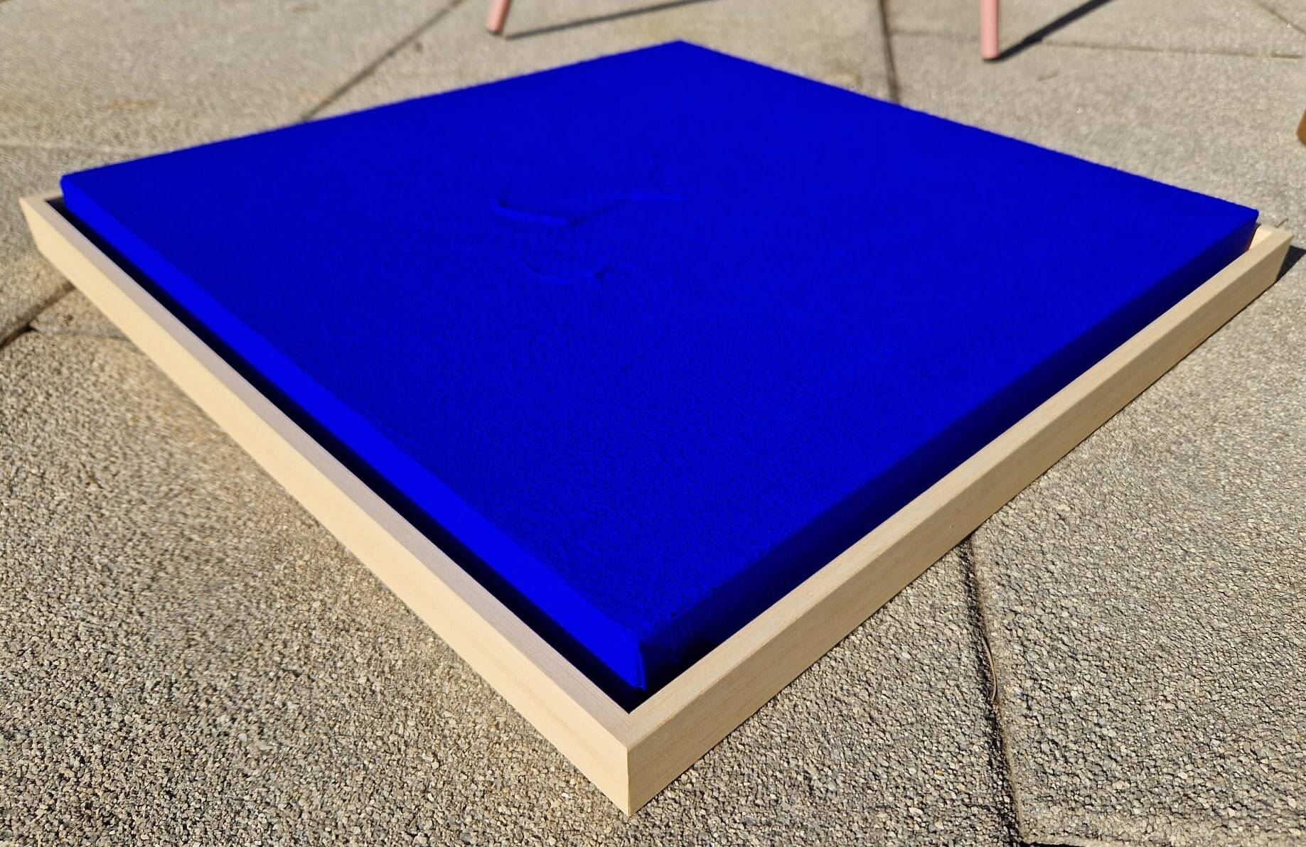 Framed monochrome blue abstract painting.