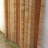 Straw and woven rope screen with metal structure