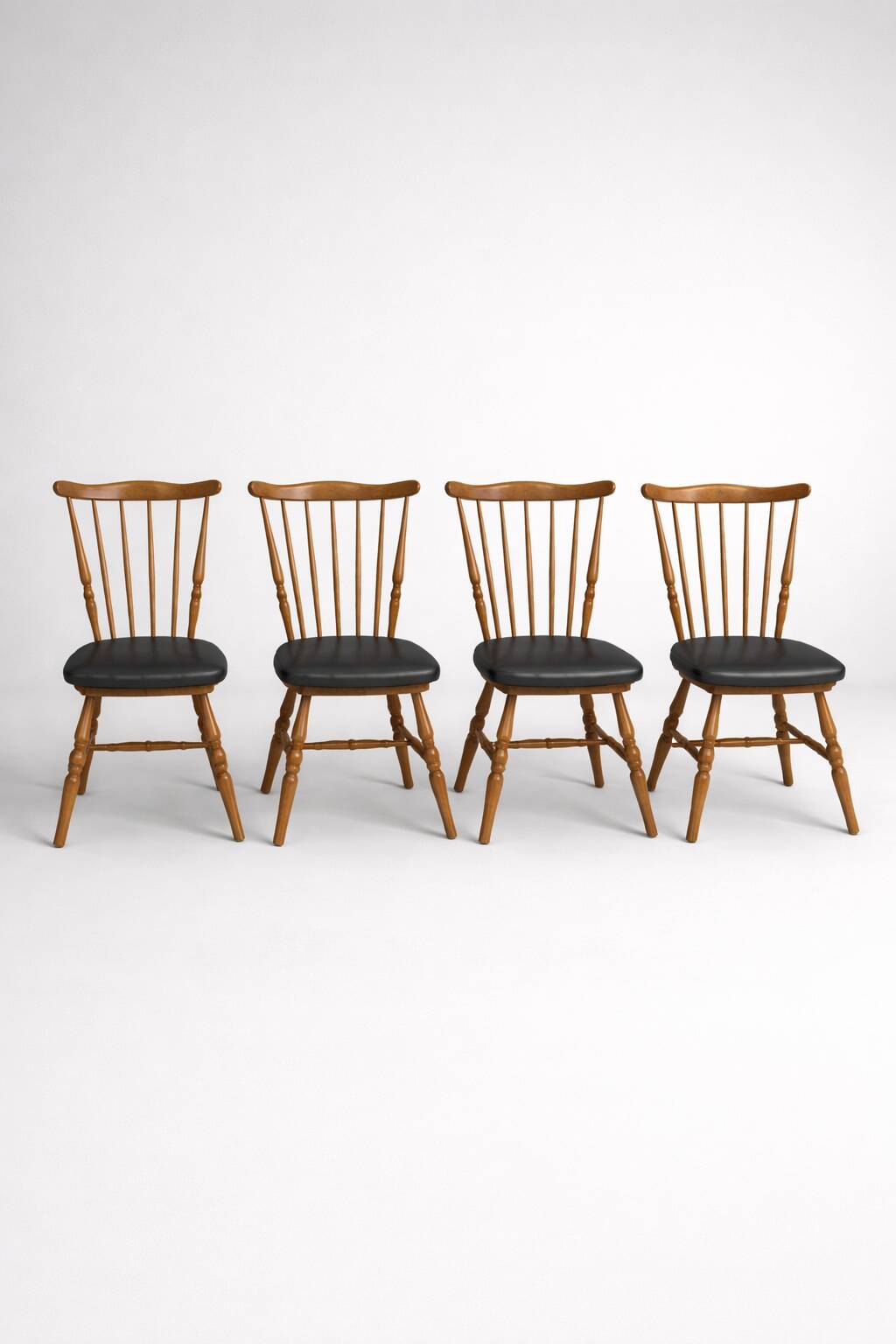 Set of 4 Baumann "Menuet" chairs – stained beech and black faux leather – French design