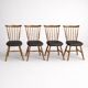 Set of 4 Baumann "Menuet" chairs – stained beech and black faux leather – French design