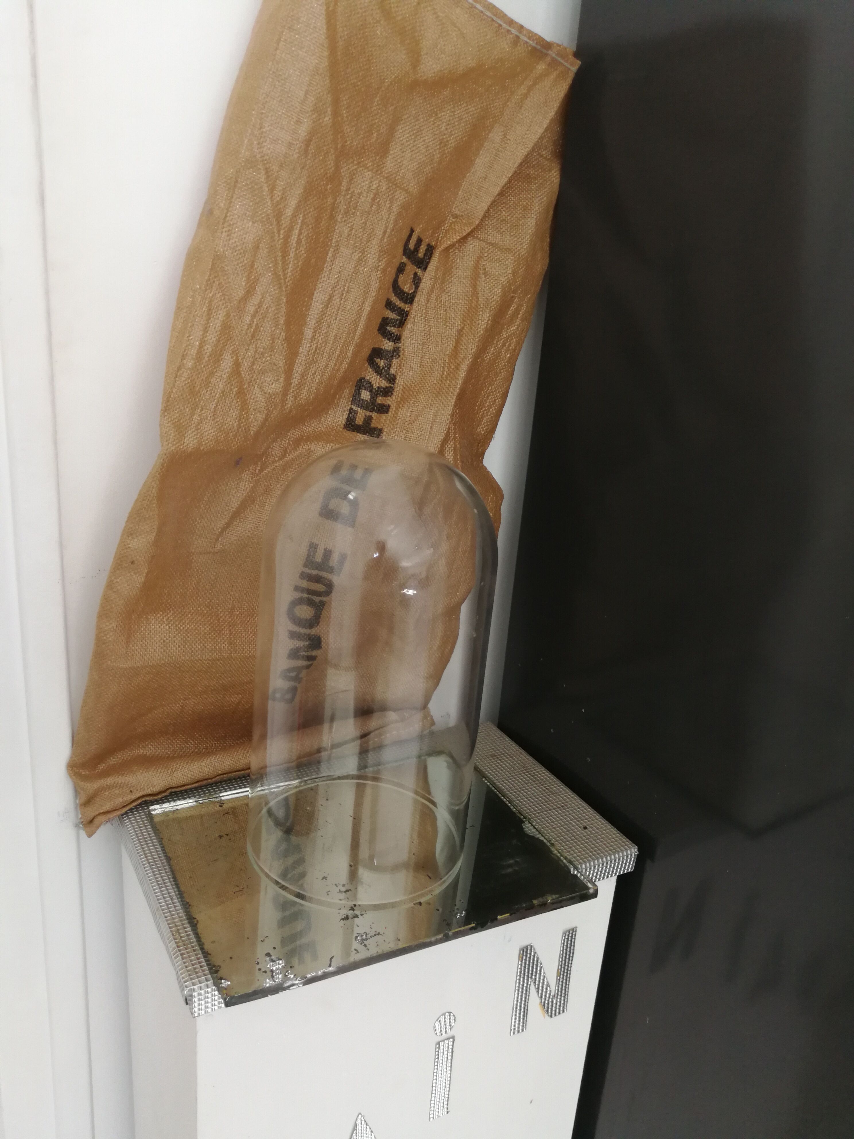 Plastic bell with mirror base