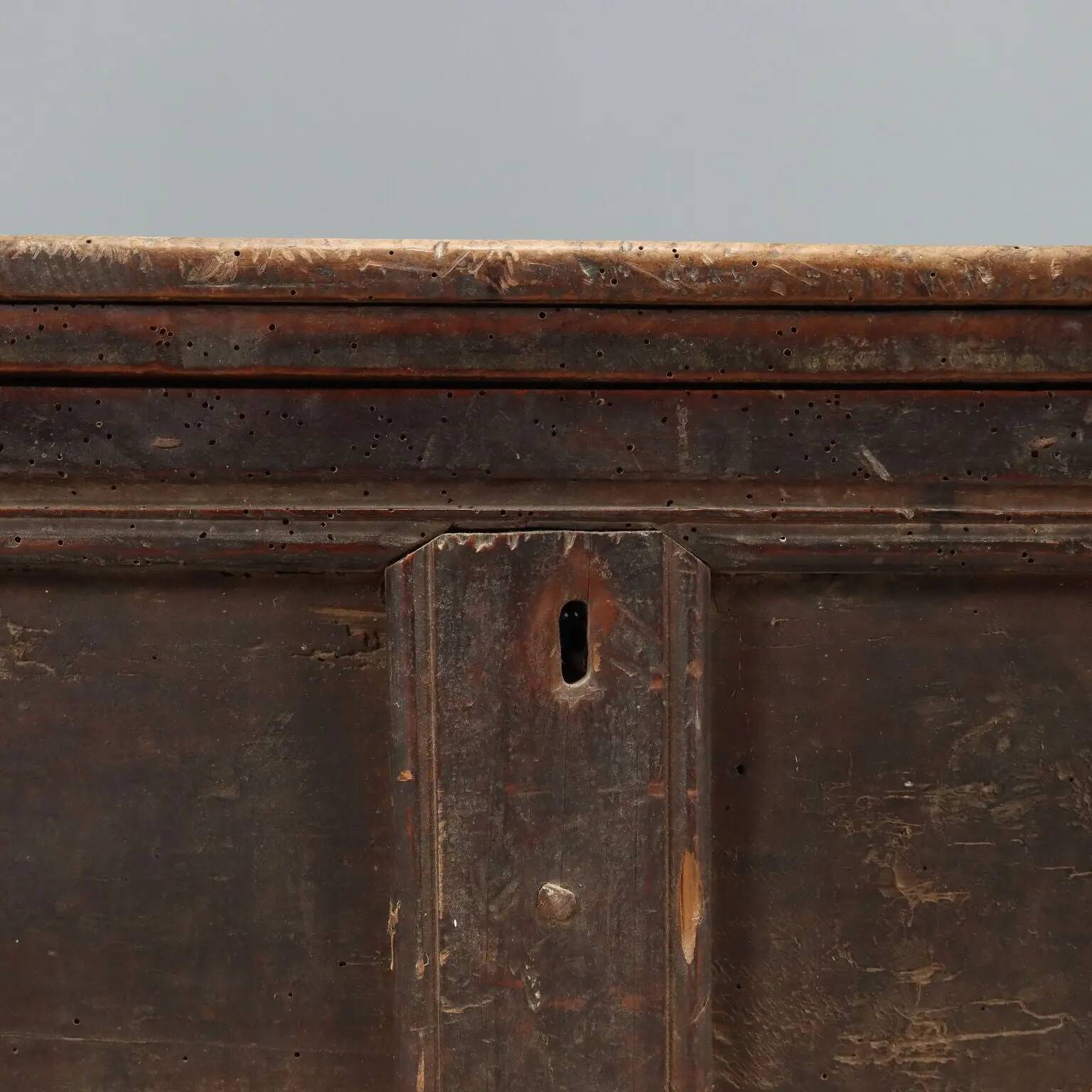 Antique walnut chest with a hinged lid, Italy, 17th century.
