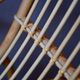 Vintage rocking chair in rattan from the 60s-70s, high openwork backrest.