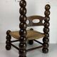 Chaise basse en bois tourné dans le style de Charles Dudouyt, France, années 1950