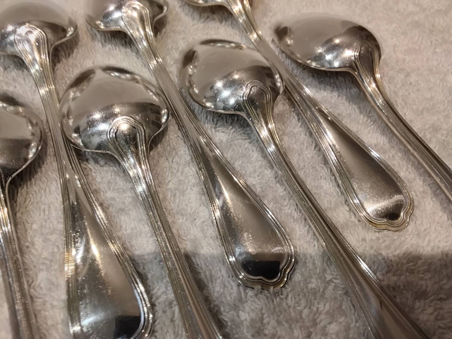 12 Christofle silver plated dessert spoons, 17cm