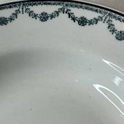 Set of 12 deep plates Saint Amand with floral garland decoration.