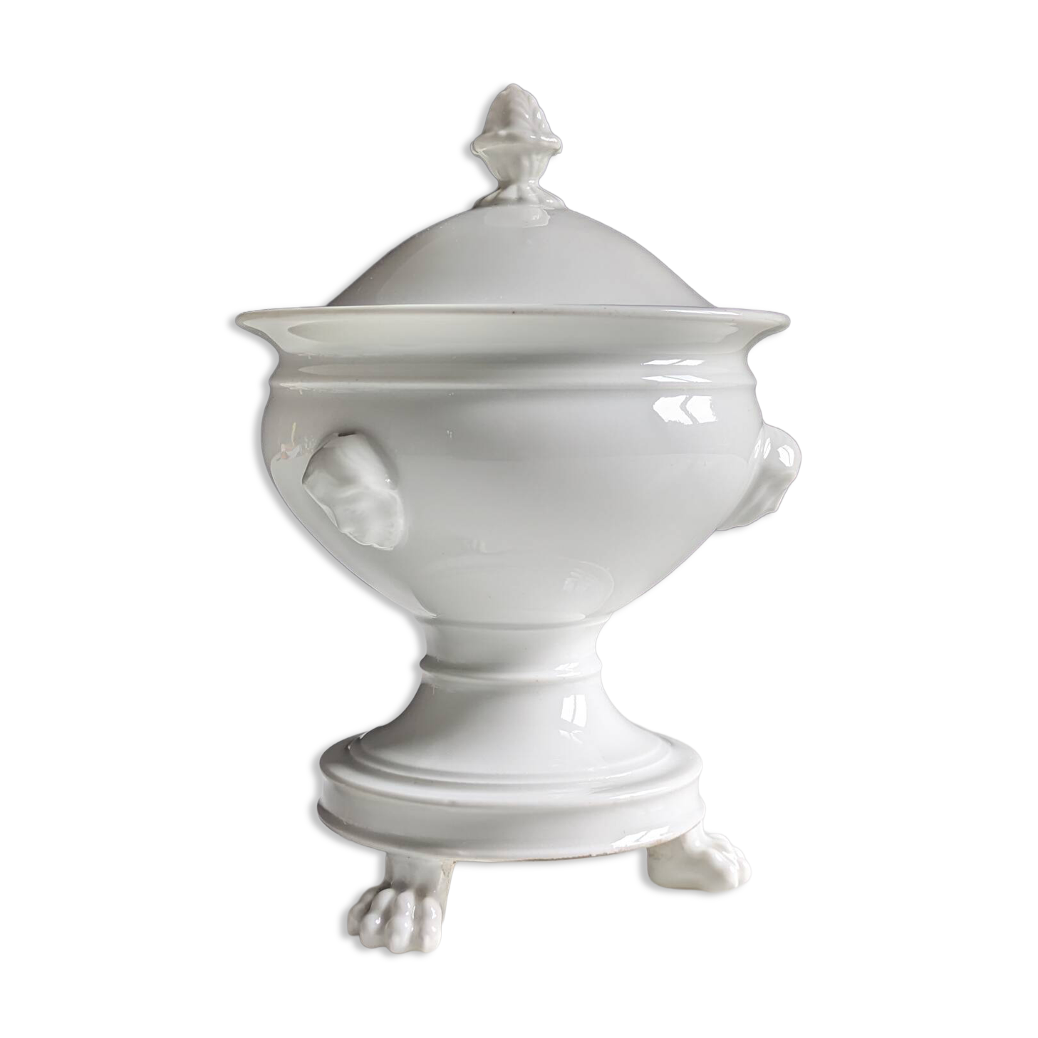 White porcelain confiturier with lion paws and masks. 19th century.