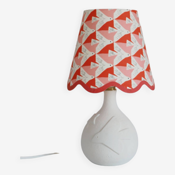 Small lamp with matte finish ceramic base and printed scalloped lampshade