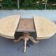 Extendable round dining table with central art deco leg, renovated in raw wood