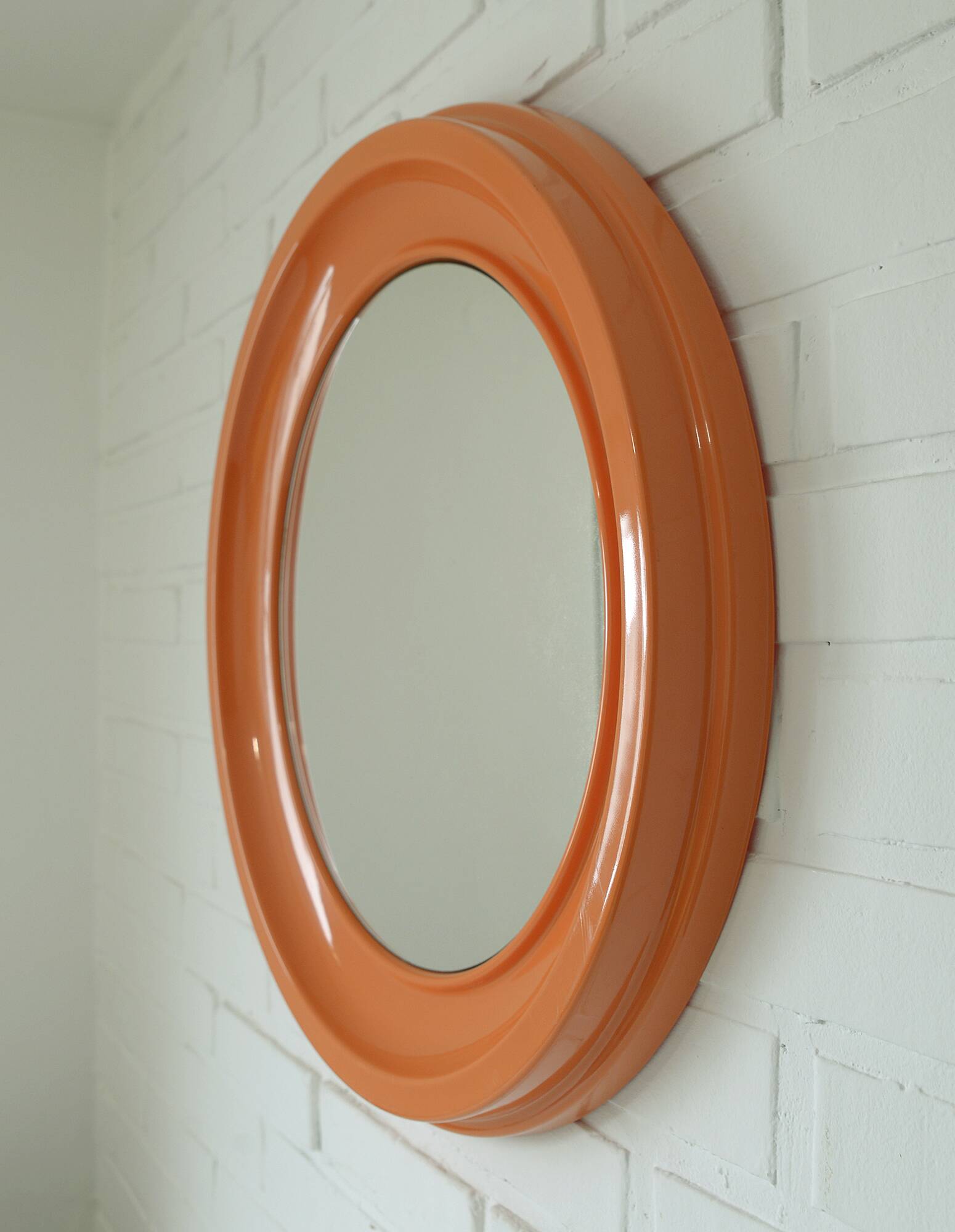 Orange vintage round wall plastic mirror 1980s, space age vanity mirror