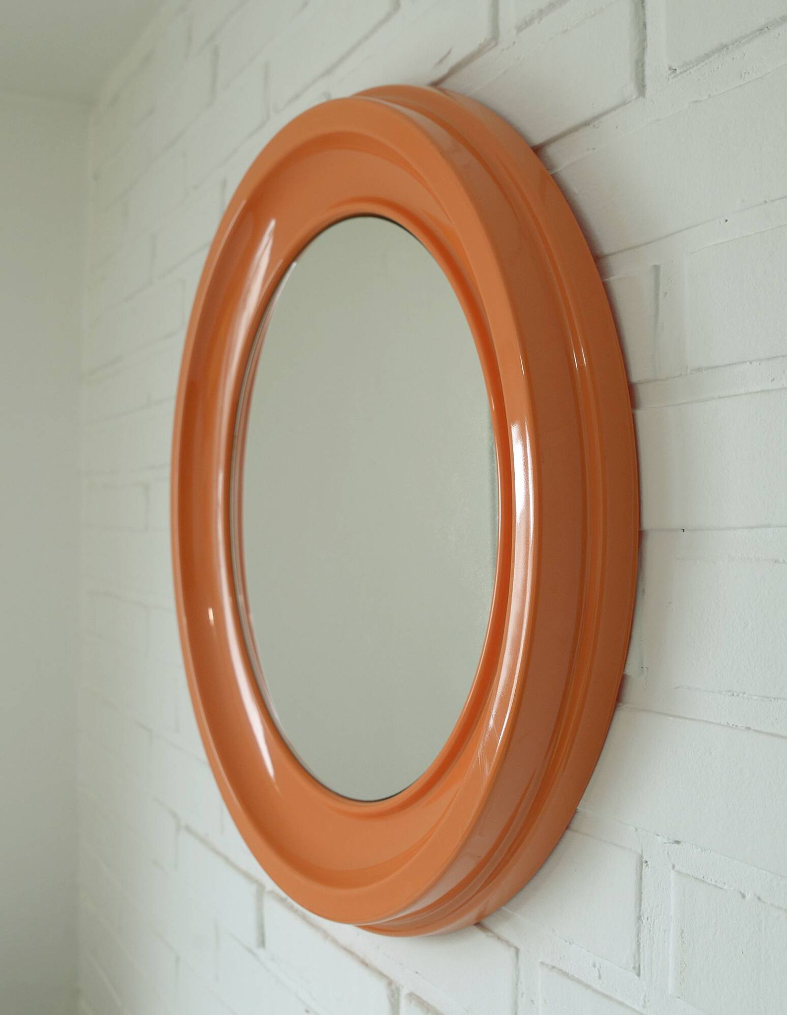 Orange vintage round wall plastic mirror 1980s, space age vanity mirror
