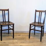 Pair of 1930s bistro chairs with patinated wood.