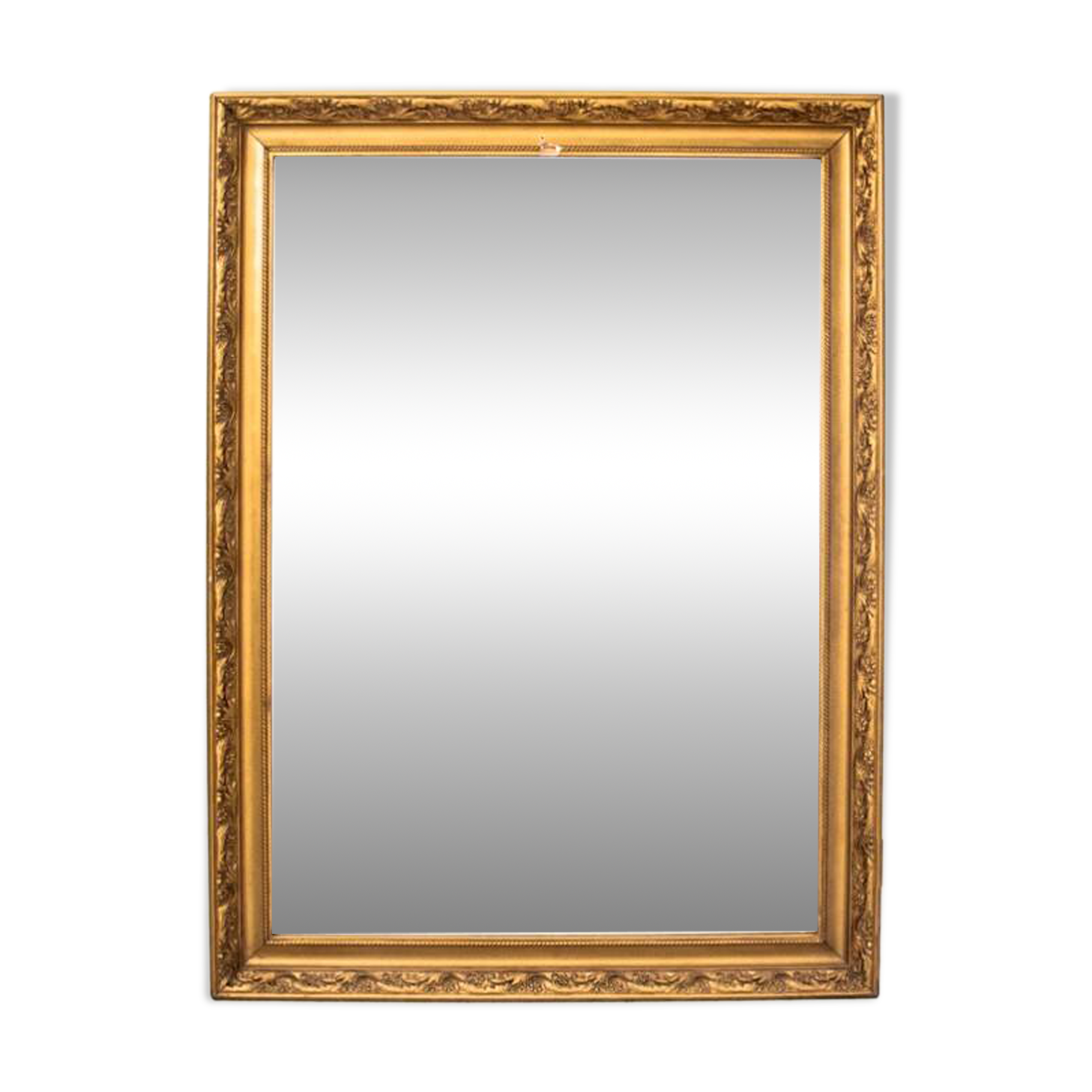 A mirror in a golden frame