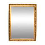 A mirror in a golden frame