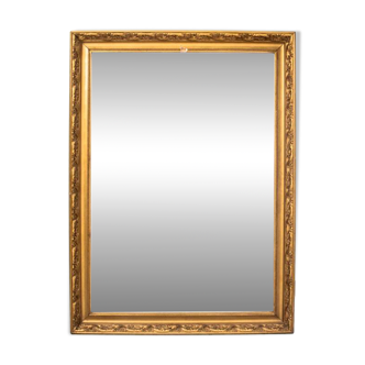 A mirror in a golden frame