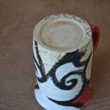 Glazed stoneware mug with snail motif signed