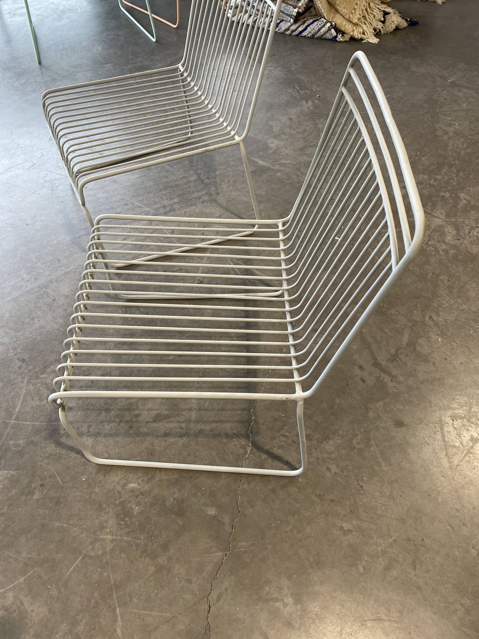 Many handcrafted wrought iron chairs