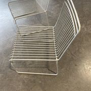 Many handcrafted wrought iron chairs
