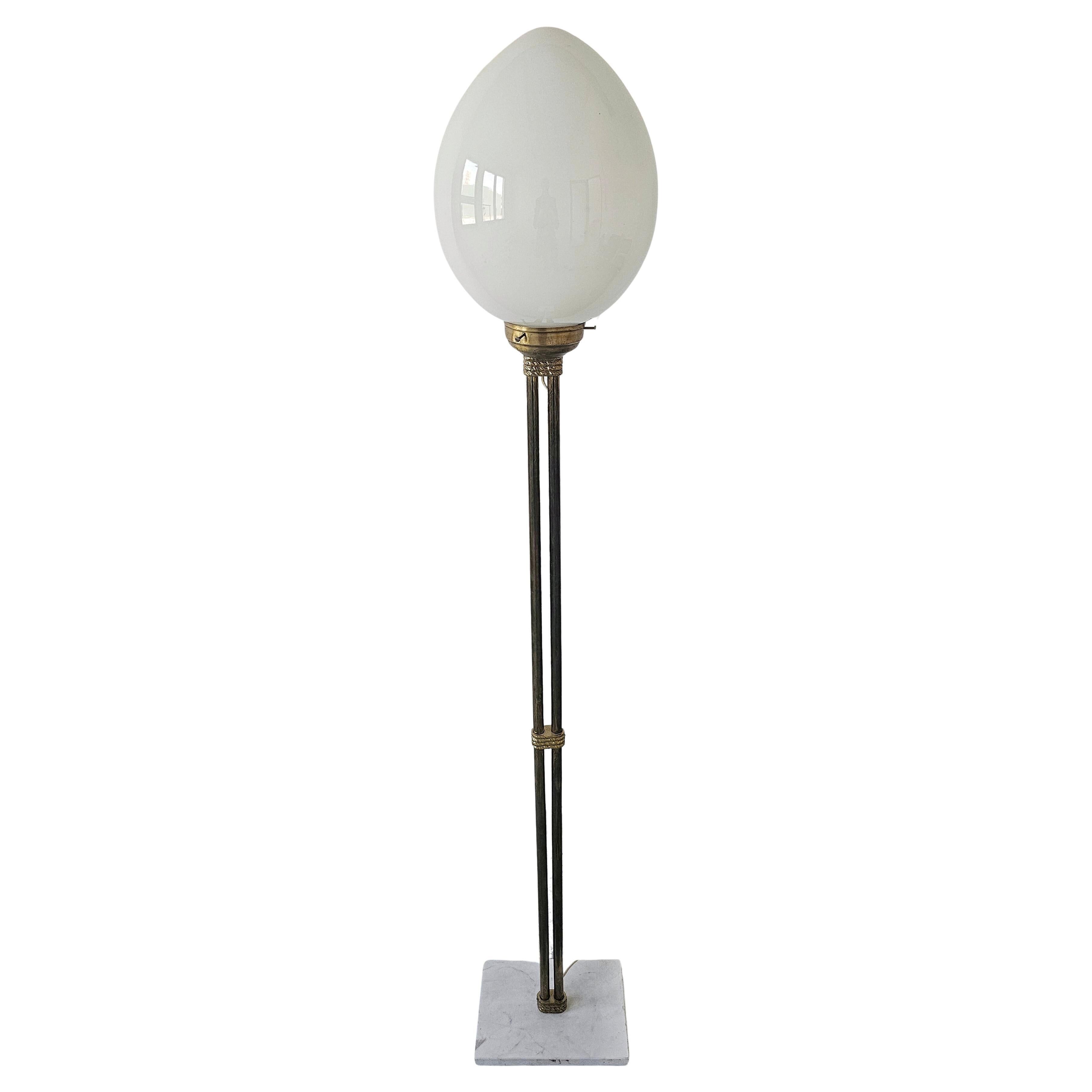 Mid-Century floor lamp with egg-shaped opal glass shade, brass base, marble base.