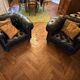 Canapé Chesterfield cuir noir + paire de fauteuils