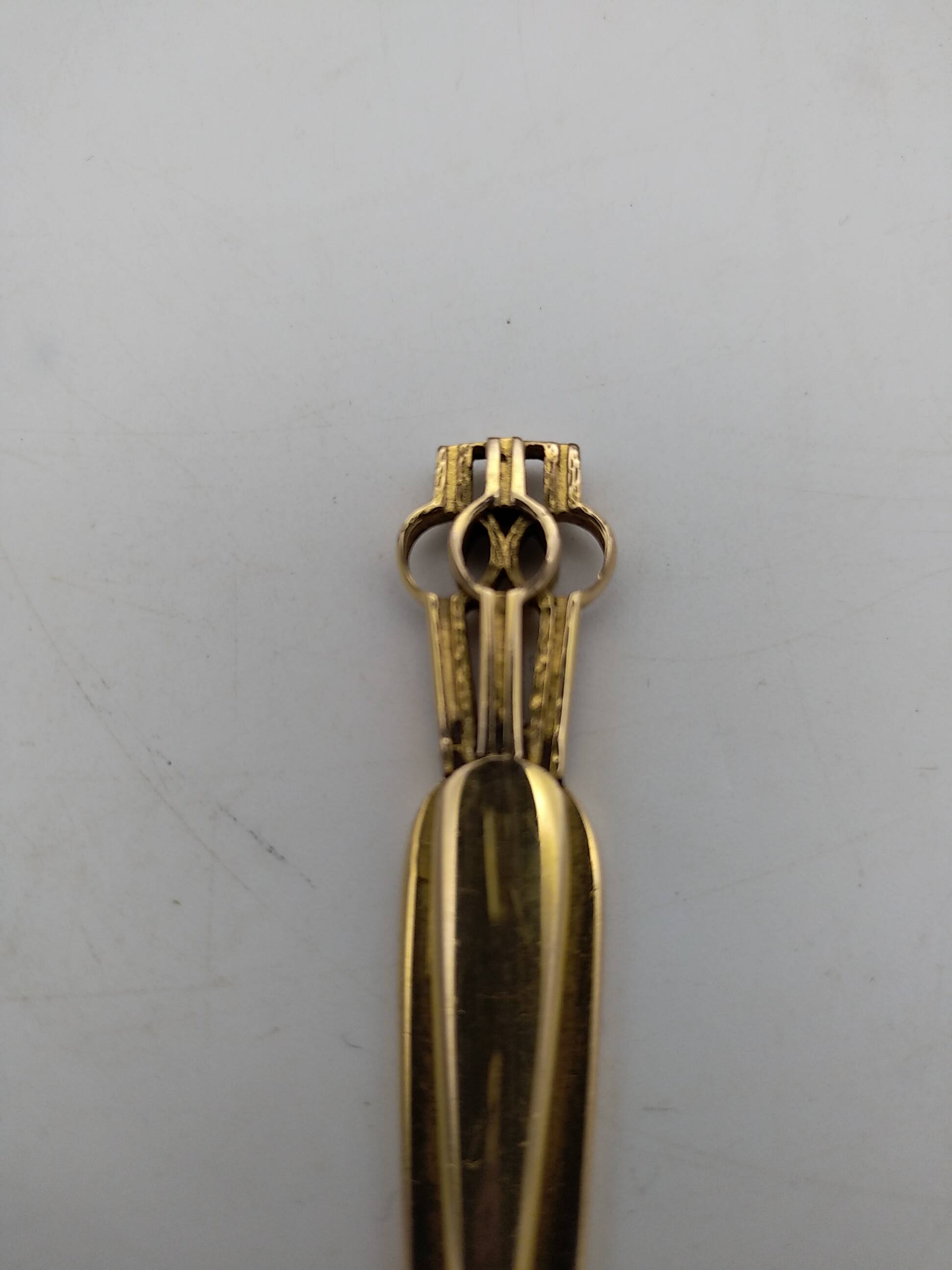 Gold plated letter opener.
