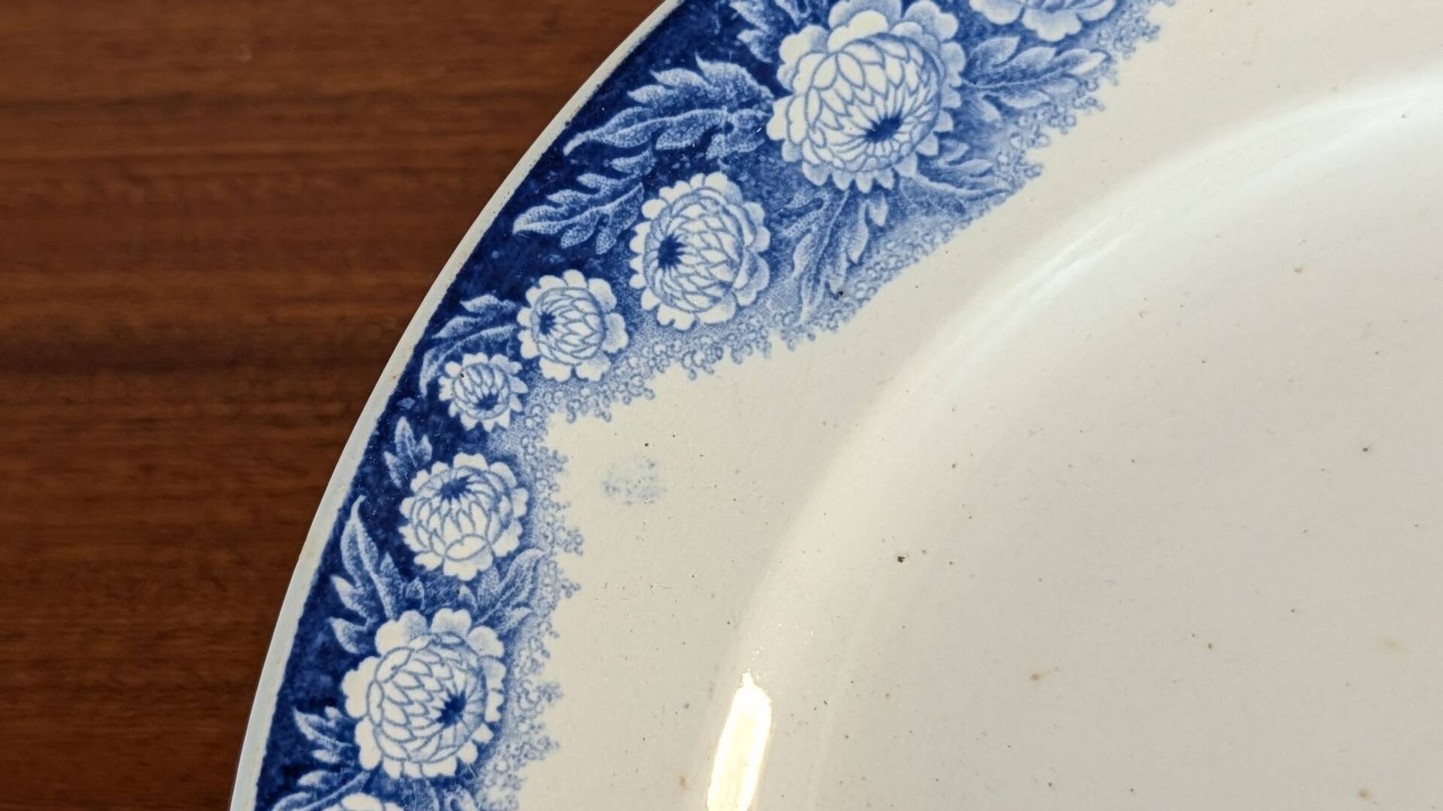 Antique compote dish with blue floral decoration.