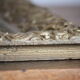 Gilded wooden and stucco frame