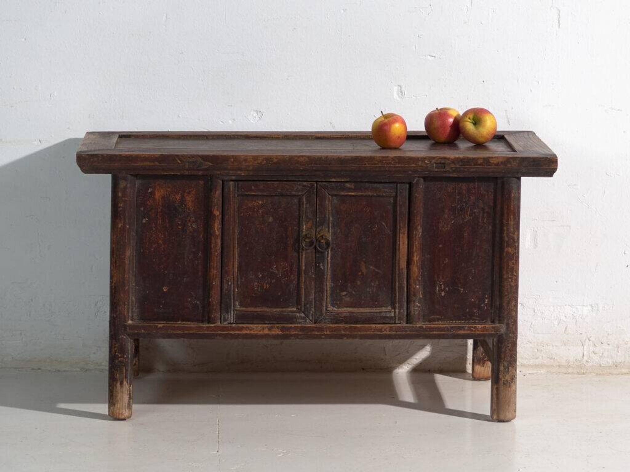 Chinese low altar cabinet with two doors and dark patina – China, around 1900