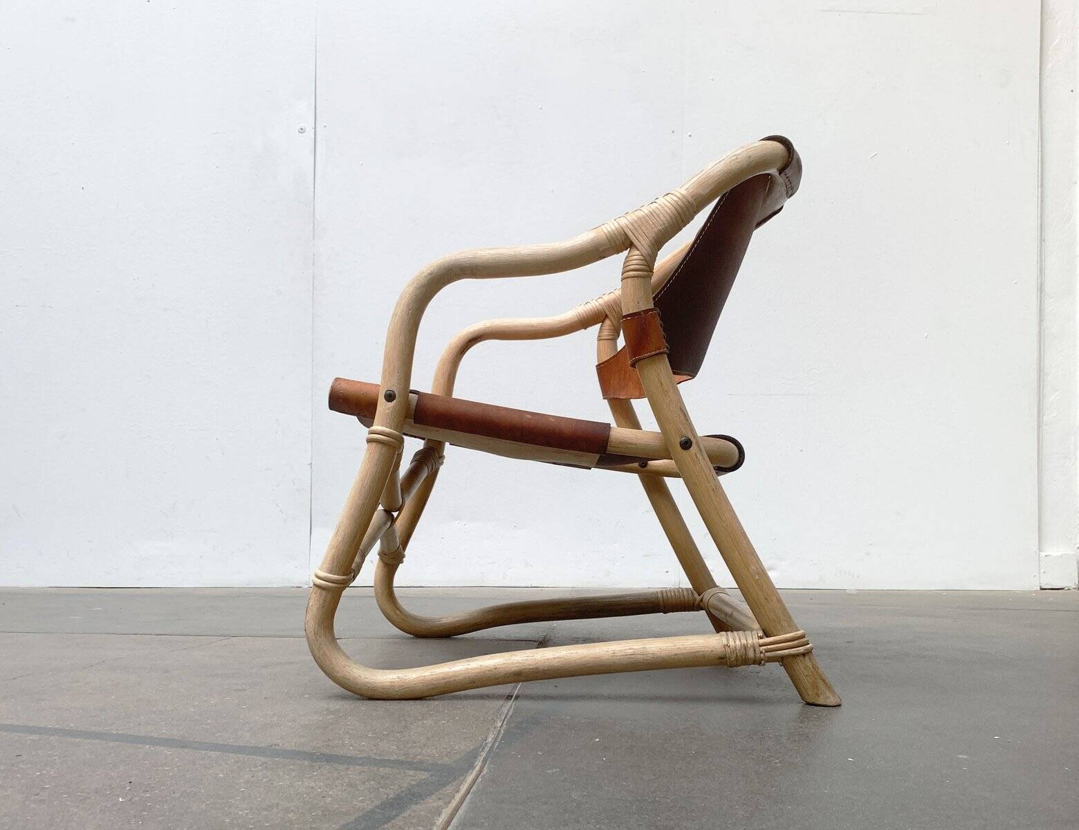 Mid-century safari lounge chair in bamboo and Danish leather, 1960s.