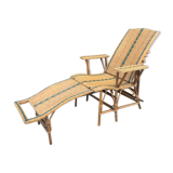 Rattan lounger with foot rest