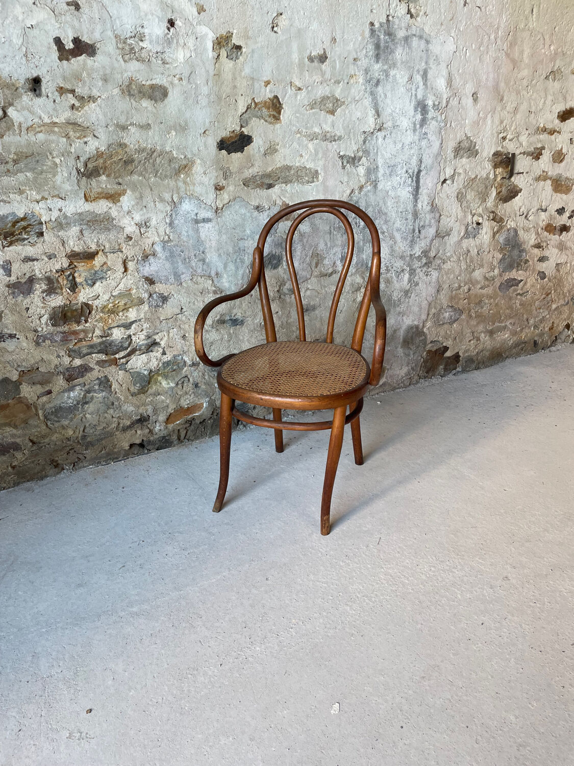 Thonet armchair with bent wood and caning