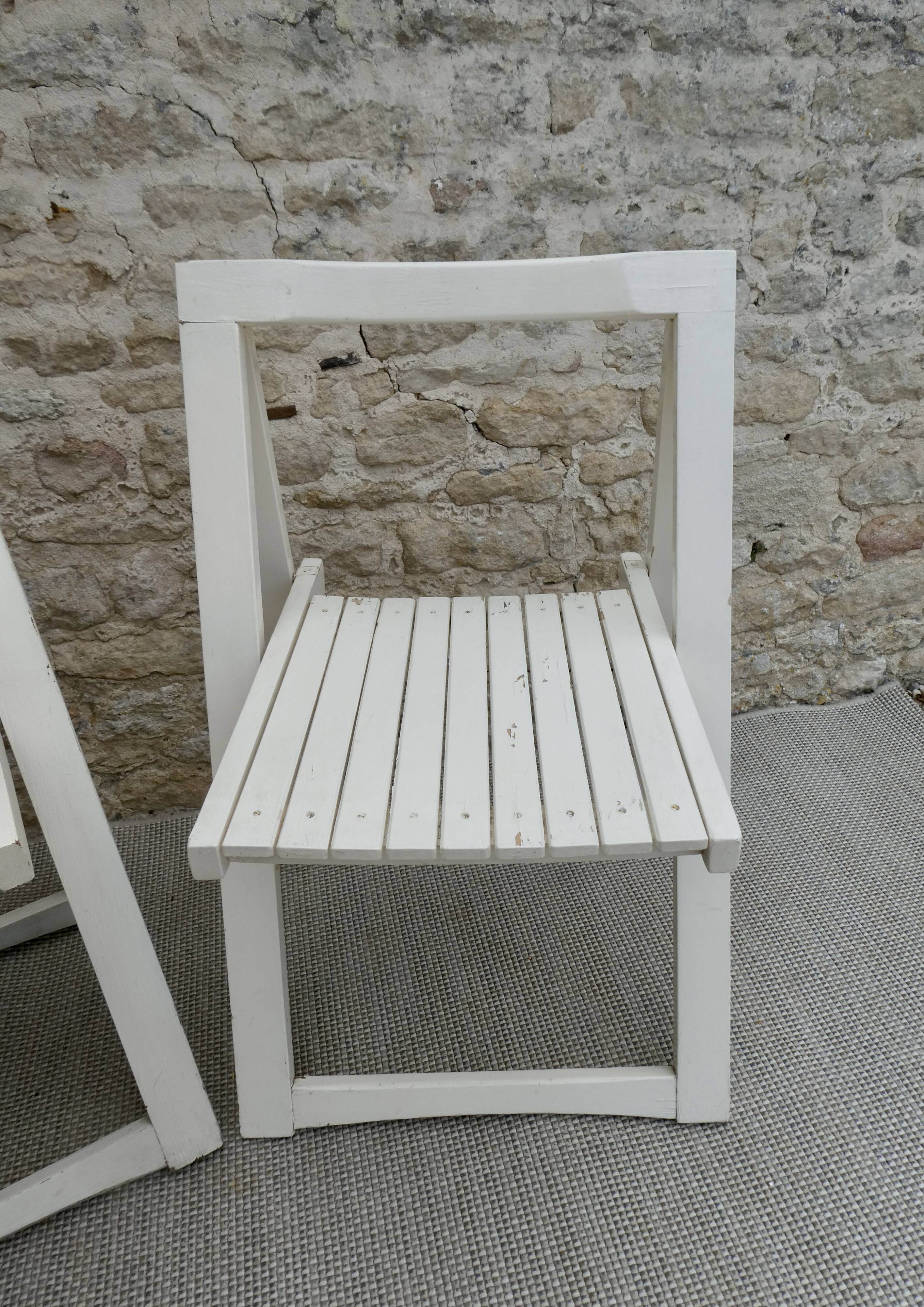 Pair of folding wooden chairs, white patina, circa 1960.