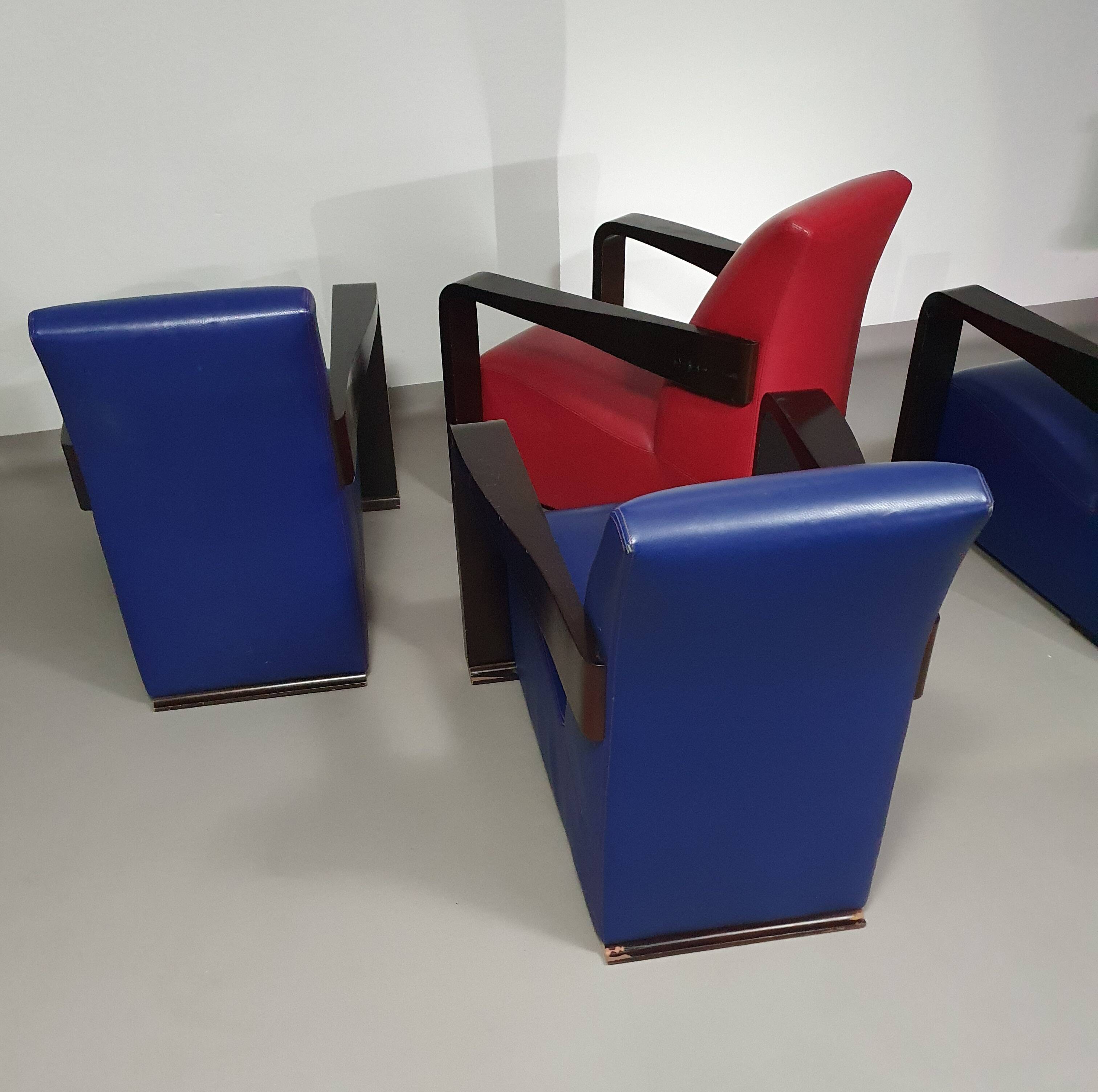 4 x Vintage Ying lounge chairs / fauteuils van Hugues Chevalier,'90. 3 x blue / 1 x red leather