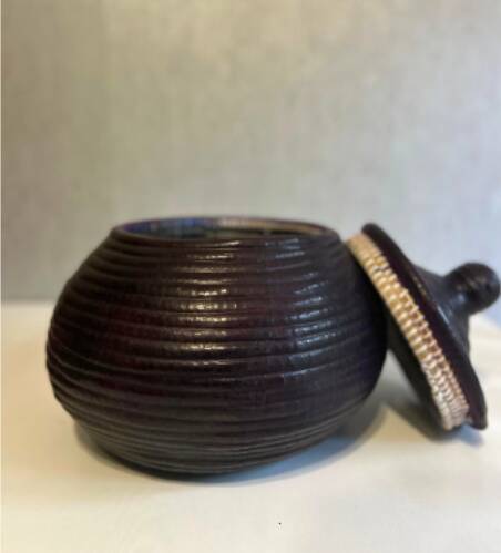 Dark purple wicker and leather round basket