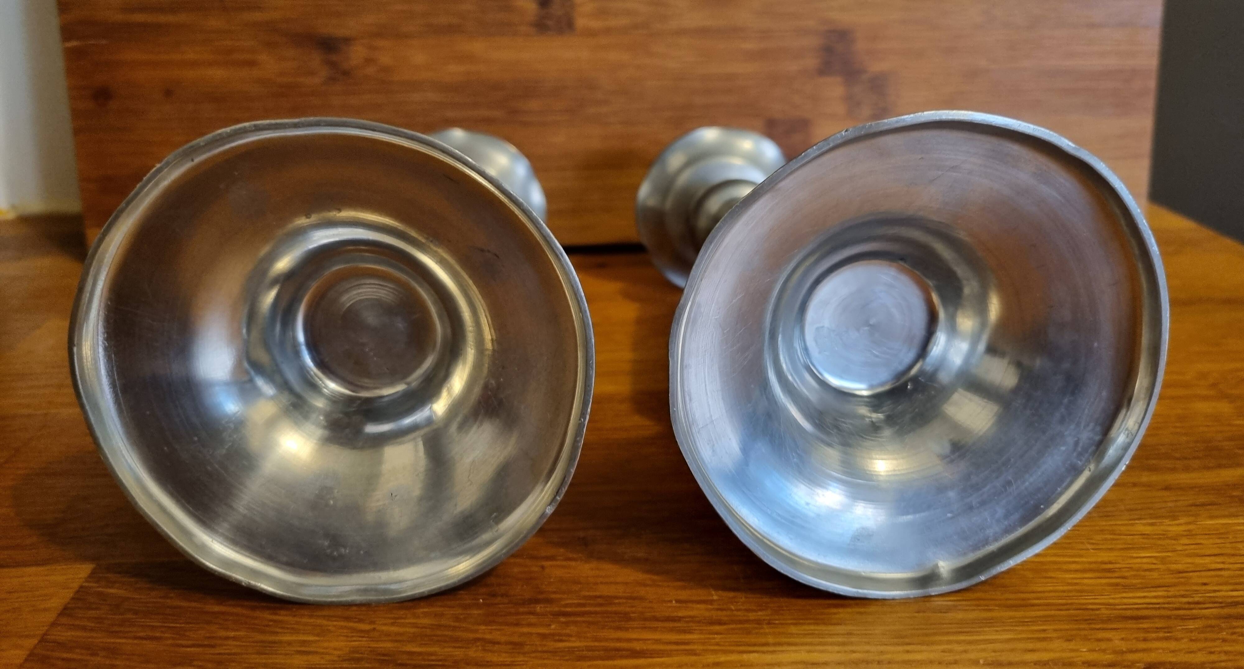 Pair of old Chinese candlesticks in engraved pewter