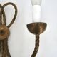 Golden wall lamp with two arms, decorated with a twisted rope bow, 1950s.