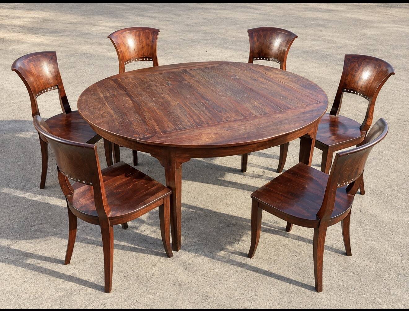 Round teak table 150 cm with 6 Indonesian chairs.