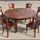 Round teak table 150 cm with 6 Indonesian chairs.