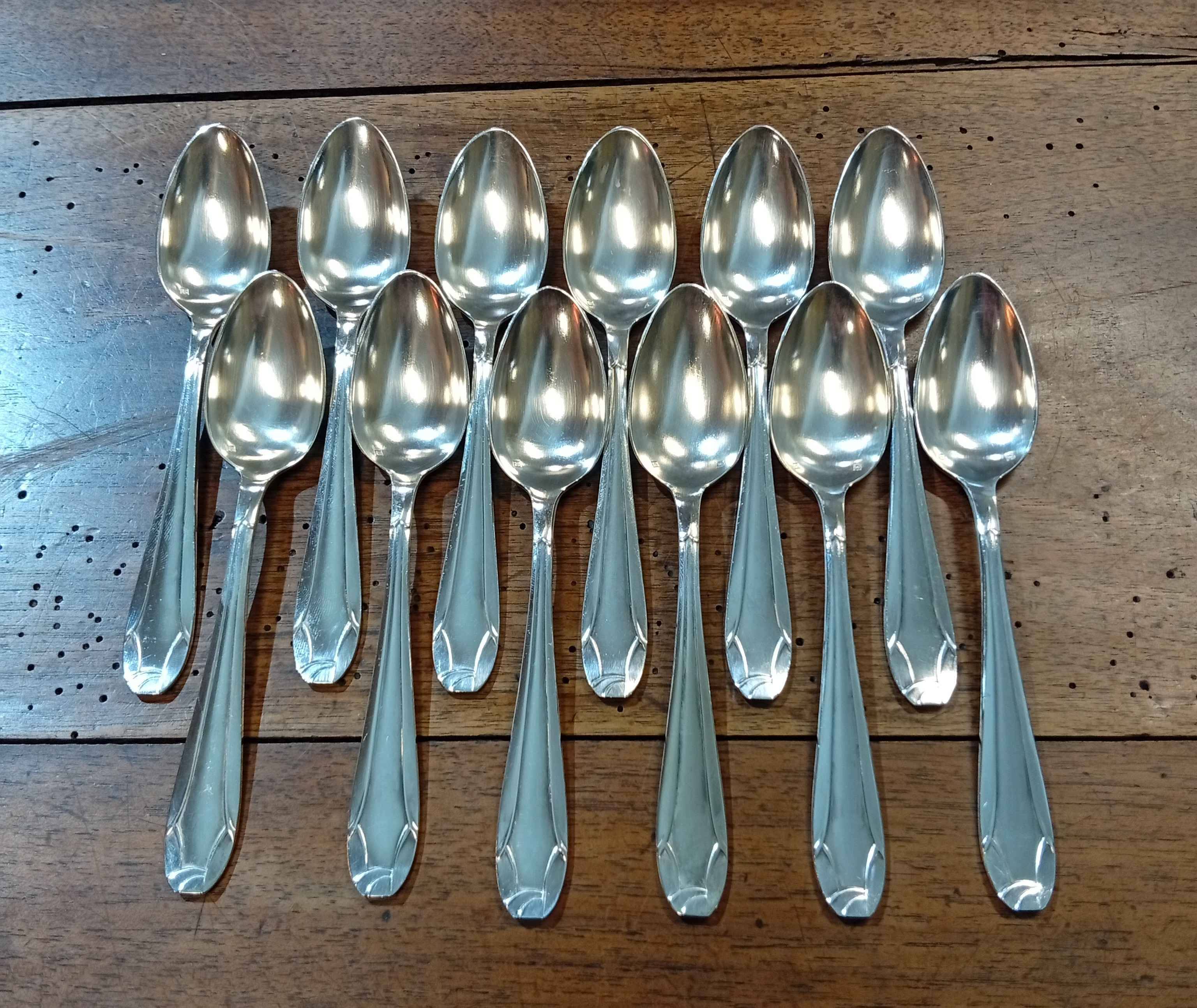 Set of 12 small silver-plated spoons in their box.