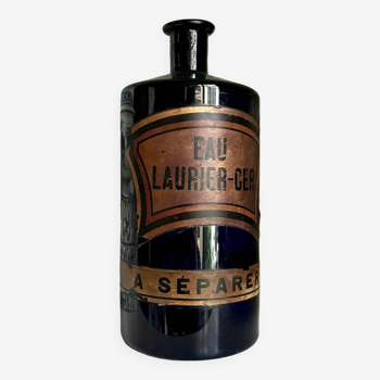 Flacon d'apothicaire eau laurier-cer. en verre bleu