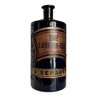 Flacon d'apothicaire eau laurier-cer. en verre bleu