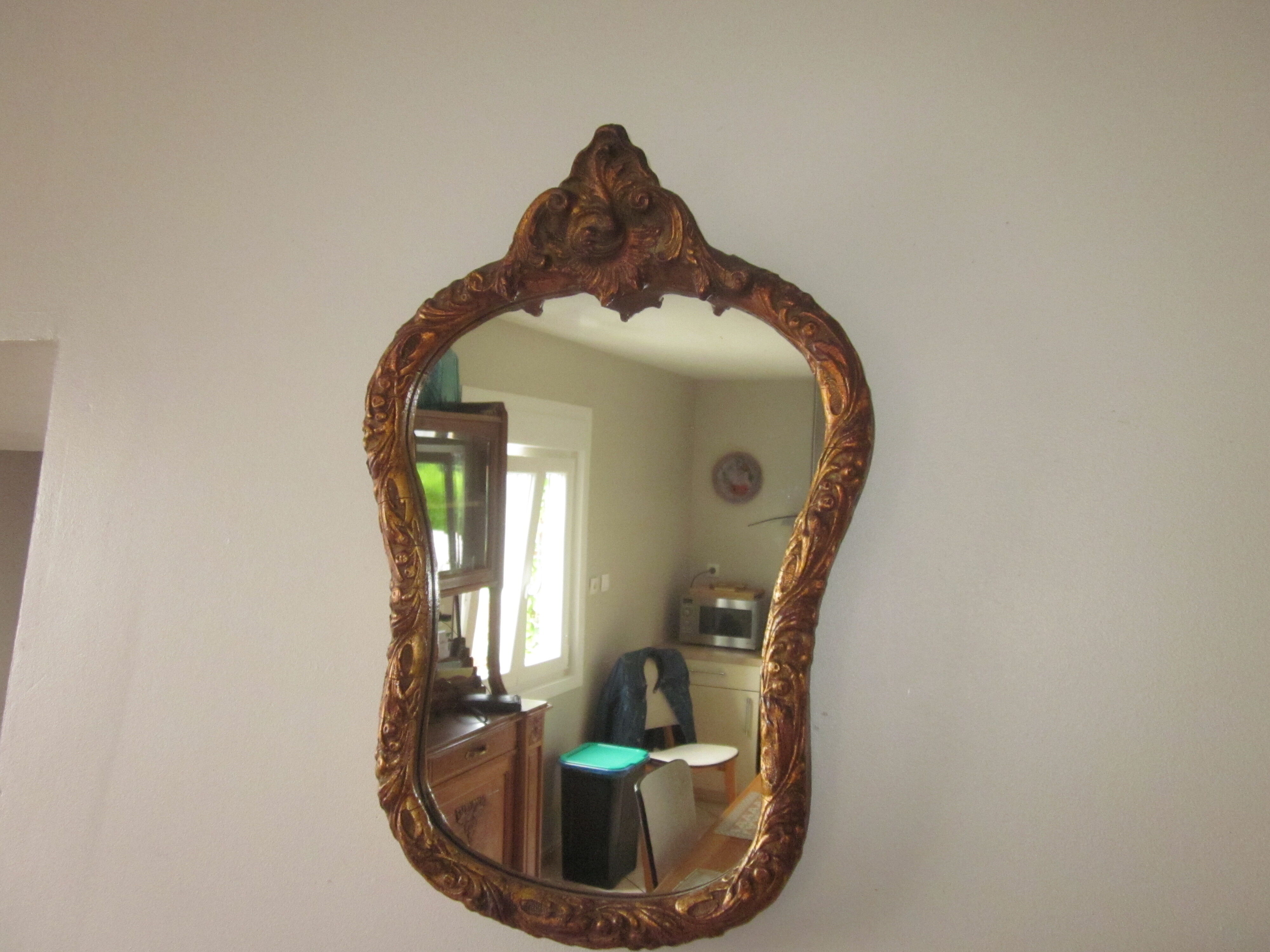 Old mirror in wood and stucco dorè