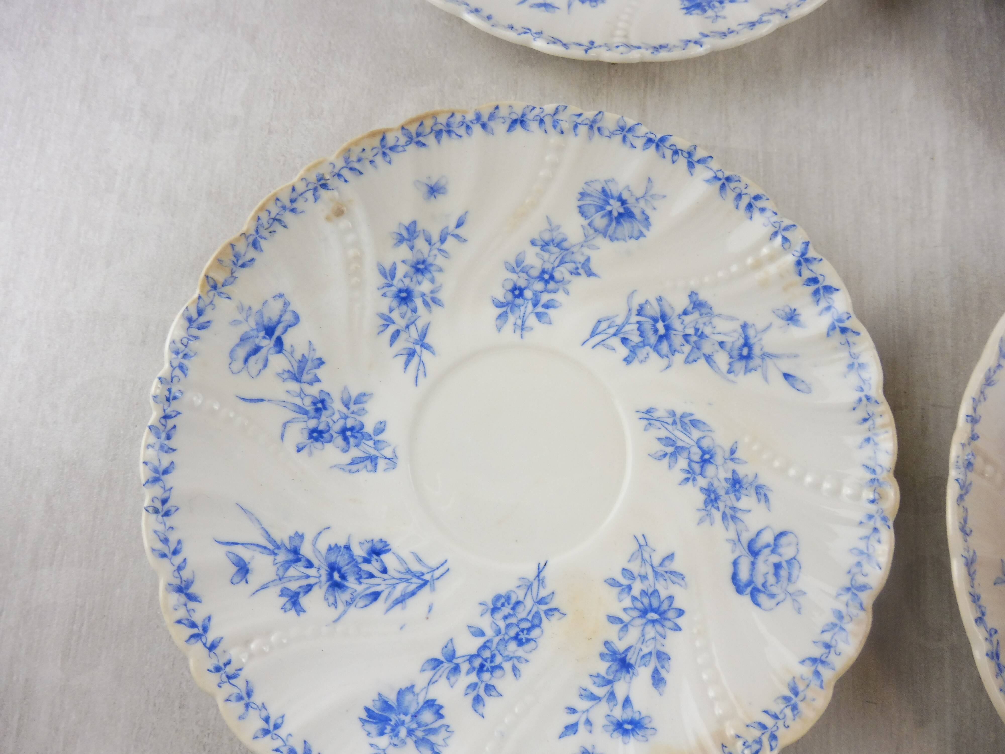 Lot of porcelain cups and under cups, twisted decoration, from Sarreguemines