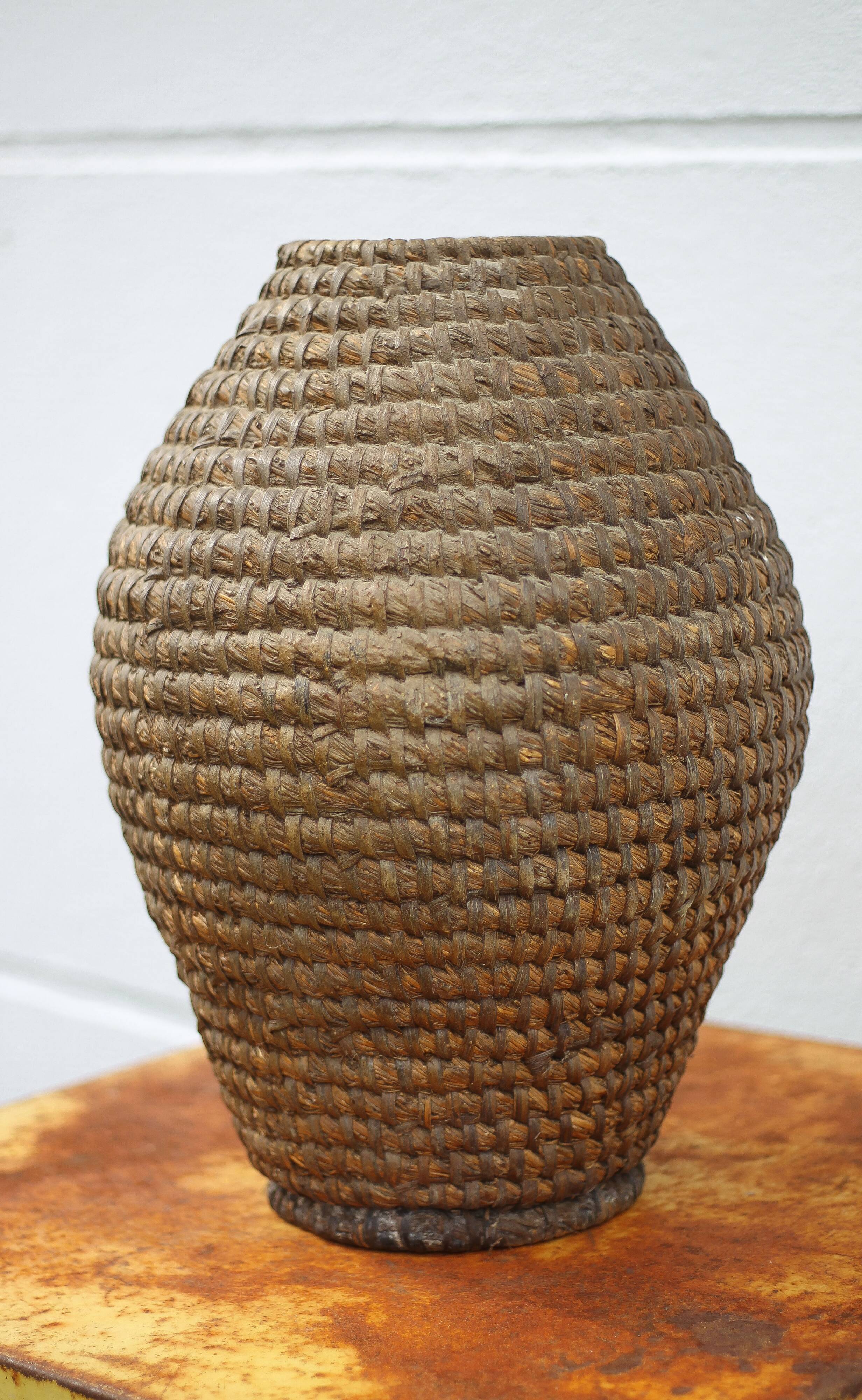 Old basket, burgundy straw and bramble, woven basket, interior decoration